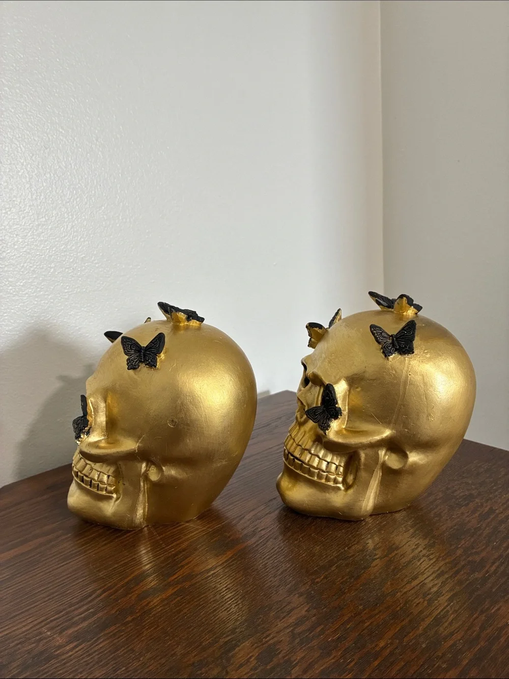 NWT- Set of 2- STUNNING- Gold Skull Statues with Black Butterflies Accents